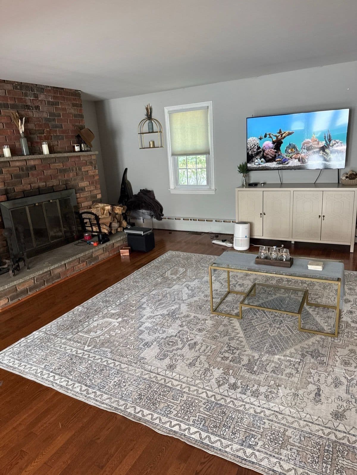 The living room before, from the fireplace toward the media wall